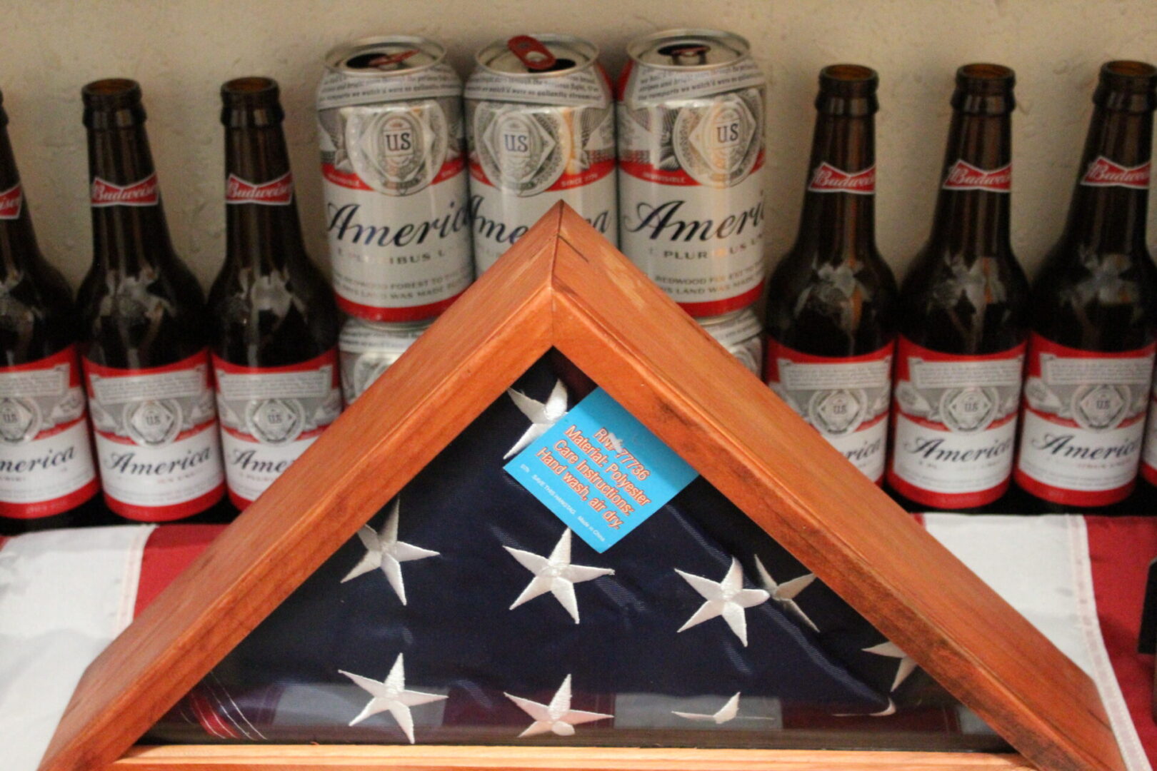 Wooden box with a cloth under it and some beer bottles